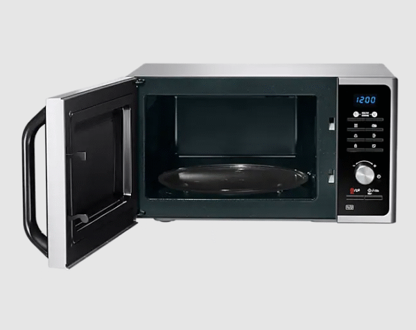Interior cavity of Samsung MS23K3614AW/EF 23L solo microwave oven with door open showing ceramic enamel interior and turntable